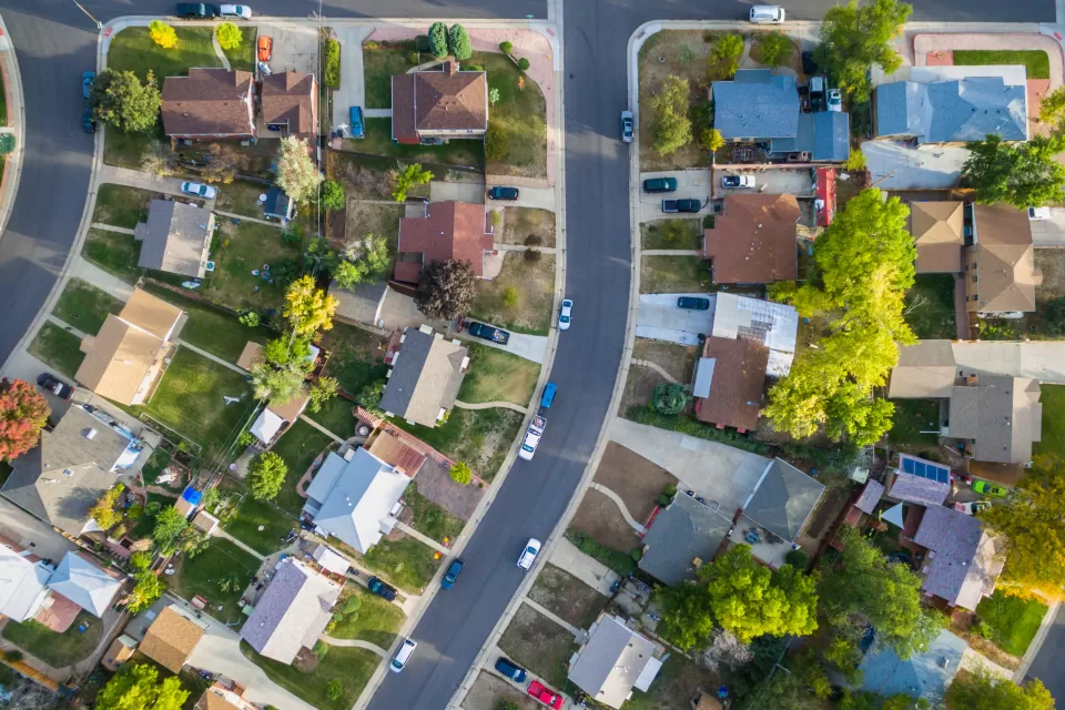 Aerial view of a single-family neighborhood with trees.